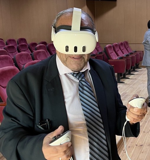 Delta University dean wearing VR headset